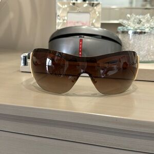 Prada sunglasses cream with light brown shield lenses